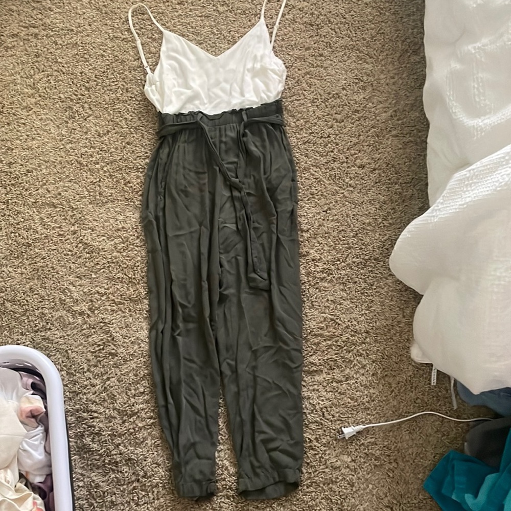 White and first green romper with felt belt in middle half zip in back xs